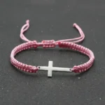 Pink braided bracelet with stainless steel cross