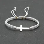 White braided bracelet with stainless steel cross