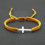 Yellow braided bracelet with stainless steel cross